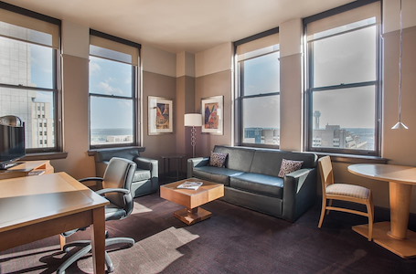Suite with Living space and Desk area