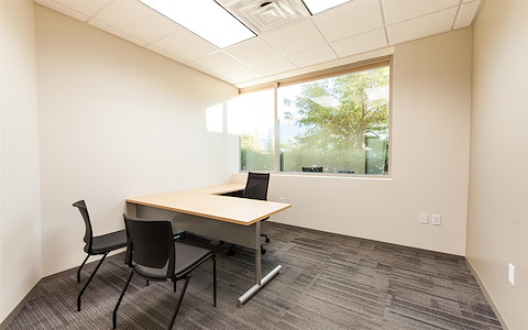 Windowed office with a mountain view